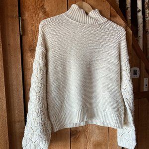 Turtleneck cream sweater